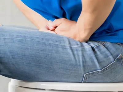 man experiencing chronic constipation and abdominal discomfort